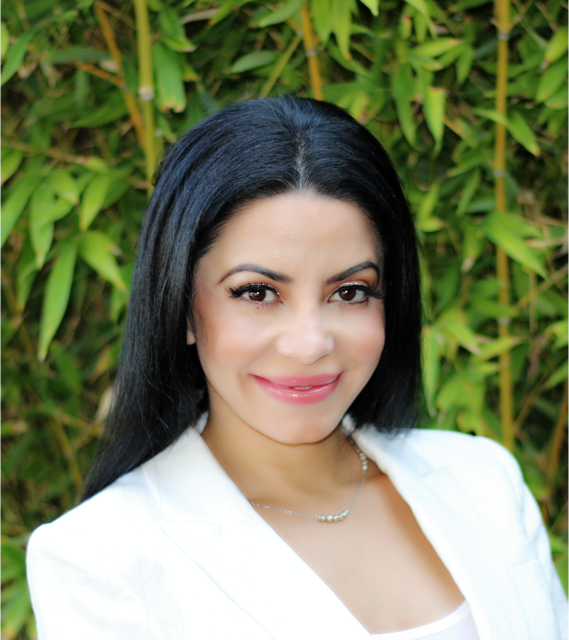 Dr. Sara Rustin wearing a white blazer